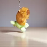 Capybara kulcstartó kihúzható felhúzható repülő állatokkal